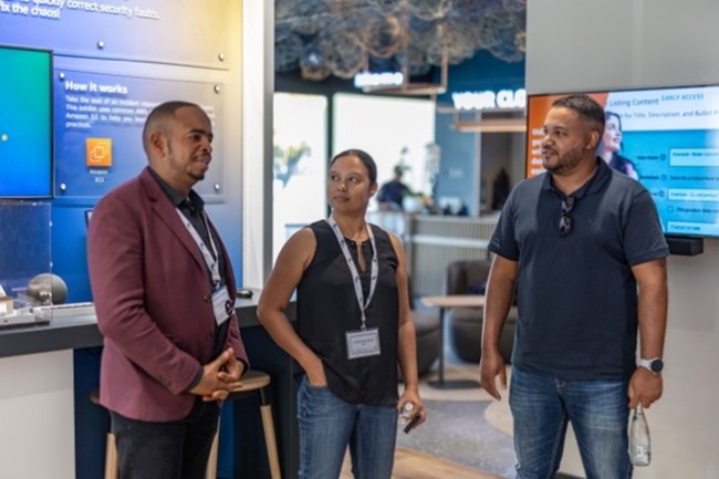 three people conversing